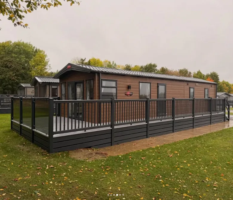 Charcoal decking with balusters and glass panels in Lympstone